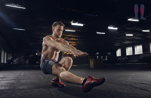 Doing one-legged pistol squat to warm up the legs. This is an advanced movement. Put this in you workout if you are strong enough.